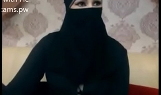 Indian Muslim girl in hijab stay chatting on webcam