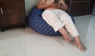 Indian wife seated topless with the door open