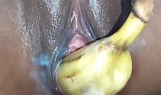 lonely horny girl put a banana inside her pussy