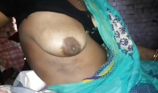Bhabhi tugjob while showing her big boobs during night time in indian Village